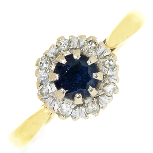 34 - A sapphire and diamond cluster ring, in 18ct gold, London 1973, 3g, size L½