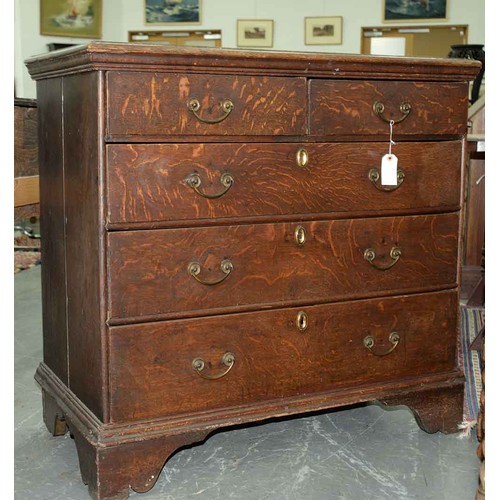 1307 - A George III oak chest of drawers, c1780, the rectangular top with moulded lip above two short over ... 