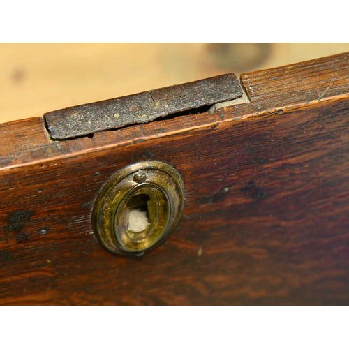 1307 - A George III oak chest of drawers, c1780, the rectangular top with moulded lip above two short over ... 