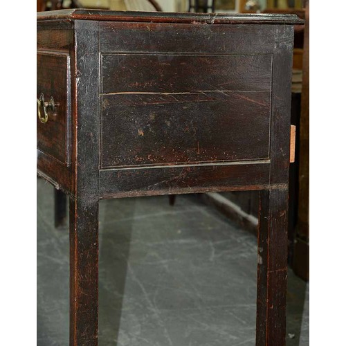 1310 - A George III elm dresser,  with moulded lip above three short drawers,   brass  loop handles,  on sq... 