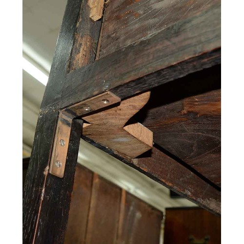 1310 - A George III elm dresser,  with moulded lip above three short drawers,   brass  loop handles,  on sq... 