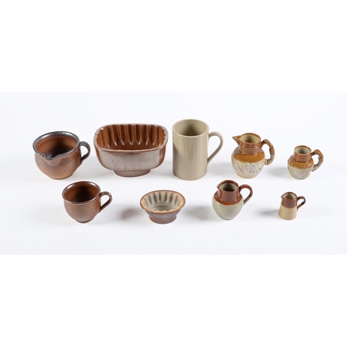 127 - Two Derbyshire saltglazed brown stoneware handled pots, Chesterfield, early-mid 19th c, 70 and 90mm ... 