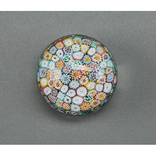 143 - A glass millefiori paperweight, 20th c,  80mm diam