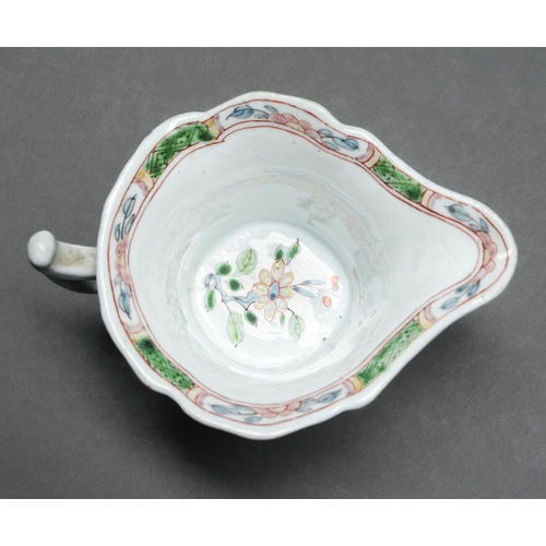 147 - An early Worcester creamboat, c1753-1757, the flared sides moulded with cartouches flanked by scroll... 