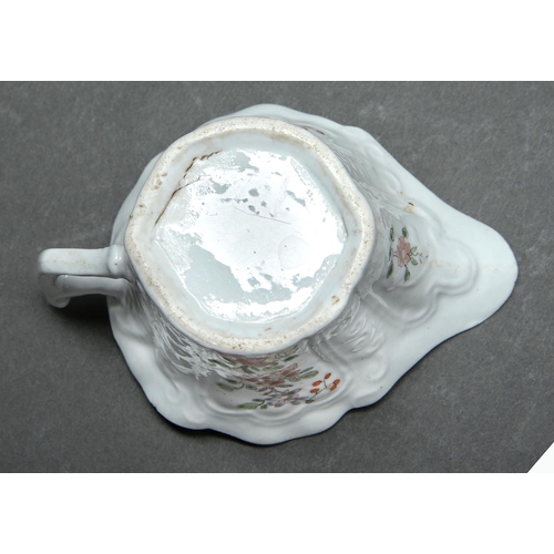 147 - An early Worcester creamboat, c1753-1757, the flared sides moulded with cartouches flanked by scroll... 