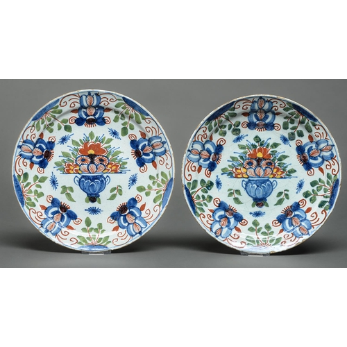 73 - A pair of English Delftware plates, possibly Bristol, c1780, painted in blue, red and green touched ... 