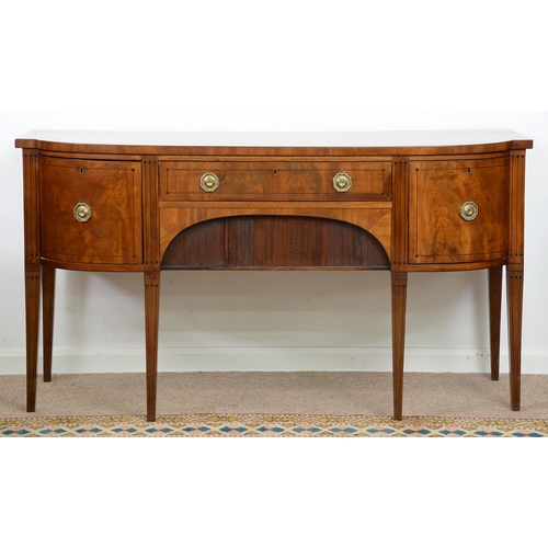 967 - A George IV mahogany bow centred sideboard, the recess to the apron enclosed by a tambour shutter, 9... 