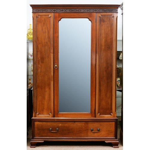 969 - A mahogany wardrobe, early 20th c, with blind fret cornice and full length bevelled mirror to the do... 