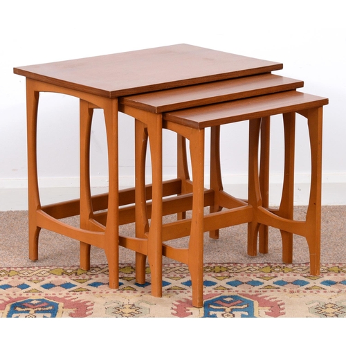 976 - A mid century teak nest of tables, 50cm h; 40 x 56.5cm (3)