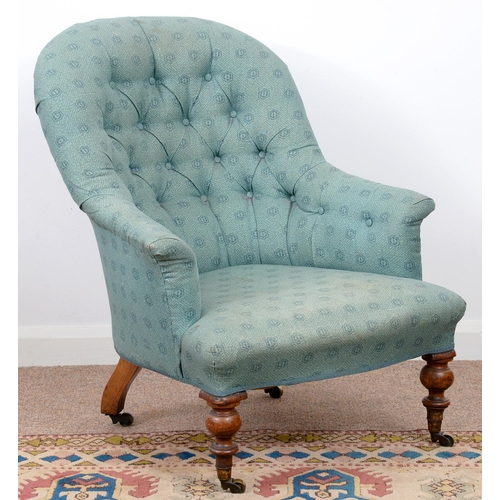 978 - A Victorian nursing chair, on turned forelegs with brass castors, later buttoned upholstery... 