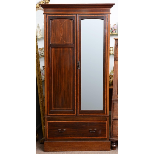 981 - An Edwardian mahogany wardrobe, crossbanded in satinwood and line inlaid, with panelled front and be... 