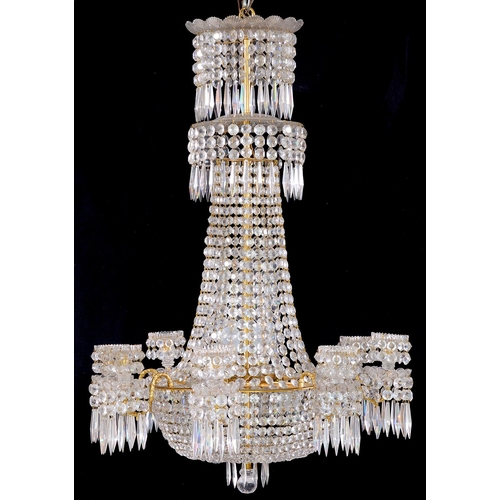 994 - A gilt brass and glass 'frame' chandelier, 20th c, in Regency style, of eight lights, the spreading ... 