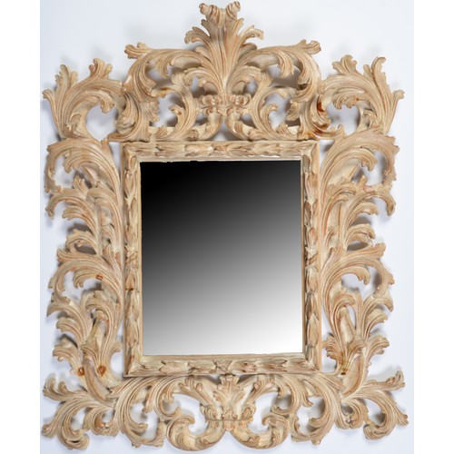 795 - An Italian baroque style carved and painted wood mirror, bevelled plate, 97cm h