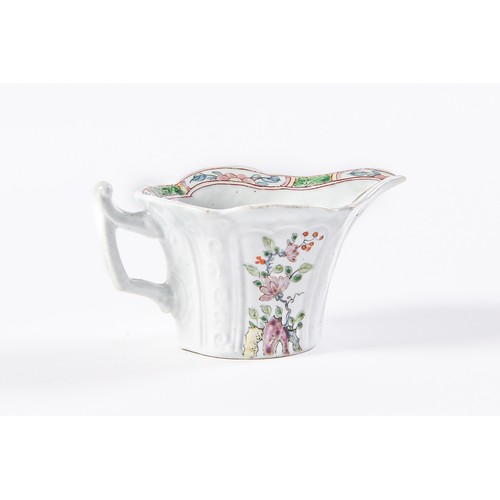 147 - An early Worcester creamboat, c1753-1757, the flared sides moulded with cartouches flanked by scroll... 