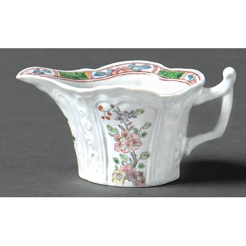 147 - An early Worcester creamboat, c1753-1757, the flared sides moulded with cartouches flanked by scroll... 