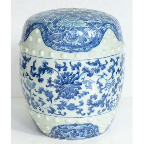 77 - A Chinese blue and white garden seat, Qing dynasty, late 19th c, of typical barrel shape with two ro... 