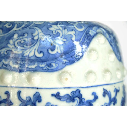 77 - A Chinese blue and white garden seat, Qing dynasty, late 19th c, of typical barrel shape with two ro... 