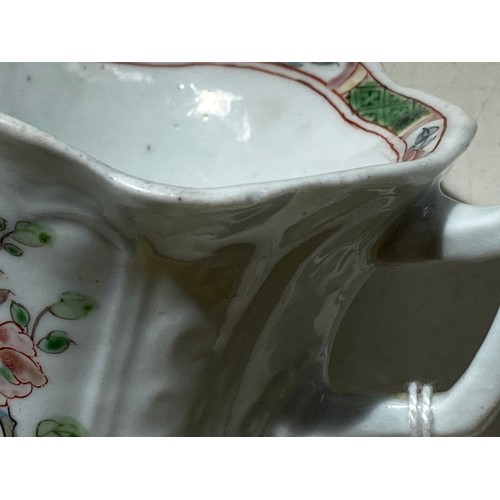 147 - An early Worcester creamboat, c1753-1757, the flared sides moulded with cartouches flanked by scroll... 