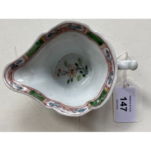 147 - An early Worcester creamboat, c1753-1757, the flared sides moulded with cartouches flanked by scroll... 