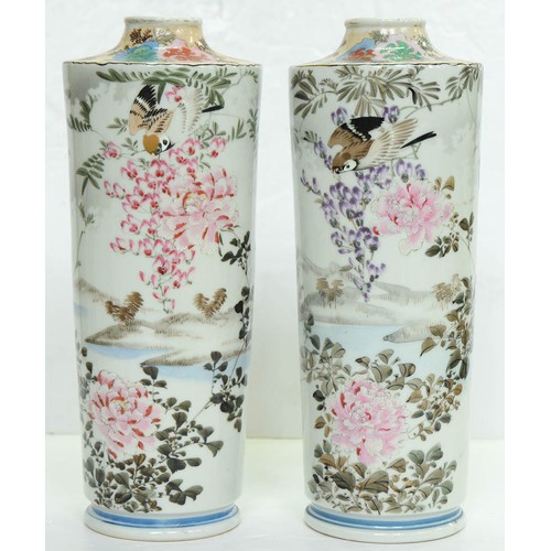 154 - A pair of Japanese cylindrical porcelain vases, early 20th c, painted with finches and flowering pla... 