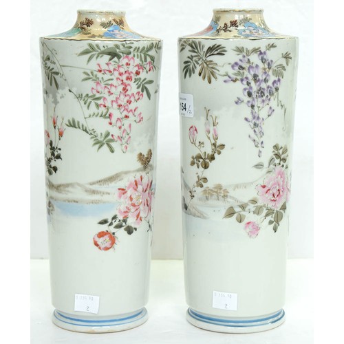 154 - A pair of Japanese cylindrical porcelain vases, early 20th c, painted with finches and flowering pla... 