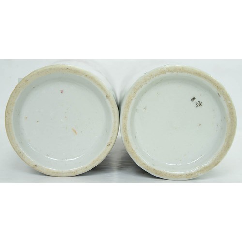 154 - A pair of Japanese cylindrical porcelain vases, early 20th c, painted with finches and flowering pla... 