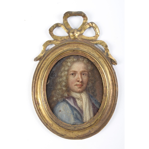 896 - British School, early 18th c - Portrait miniature of a Gentleman, in a blue coat, oil on copper, ova... 