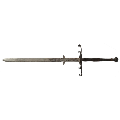 970 - A German hand-and-a-half sword, 19th c, in 16th c style, the broad flat double-edged blade, ricasso ... 