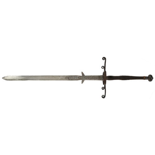 970 - A German hand-and-a-half sword, 19th c, in 16th c style, the broad flat double-edged blade, ricasso ... 