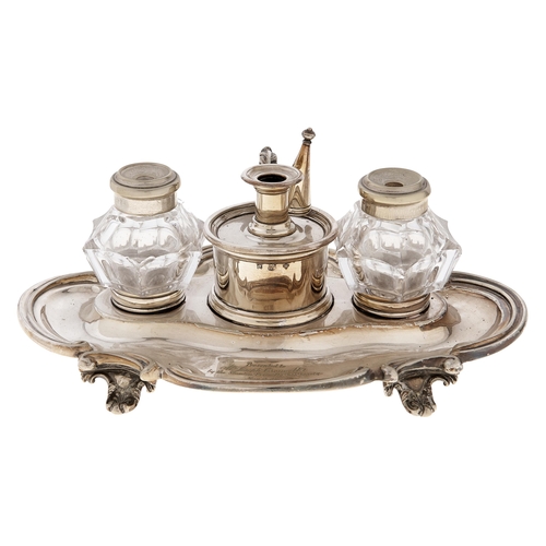 392A - A Victorian EPNS inkstand, with pair of glass inkwells and taperstick and extinguisher, engraved Pre... 