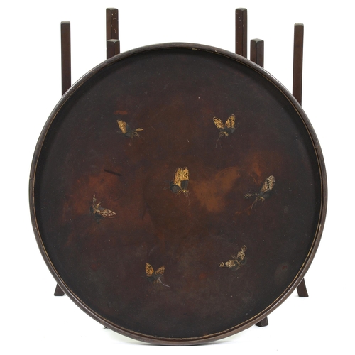 1186 - A Japanese lacquer tray on folding wood stand, early 20th c, decorated with butterflies on brown gro... 