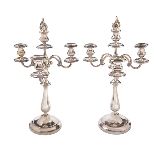 392 - A pair of French EPNS candelabra, mid 20th c, of three branches, the four lights with flambeau finia... 