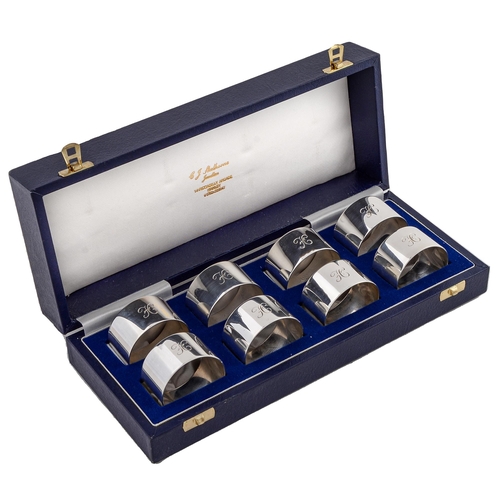 409 - A set of eight Elizabeth II silver napkin rings, initialled H, by C J Skelhorne, Birmingham 2000, ca... 