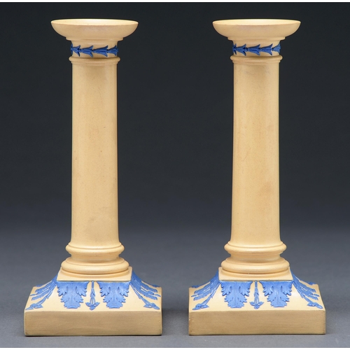 478 - A pair of Wedgwood smear glazed drabware candlesticks, c1830, ornamented in blue with acanthus leave... 