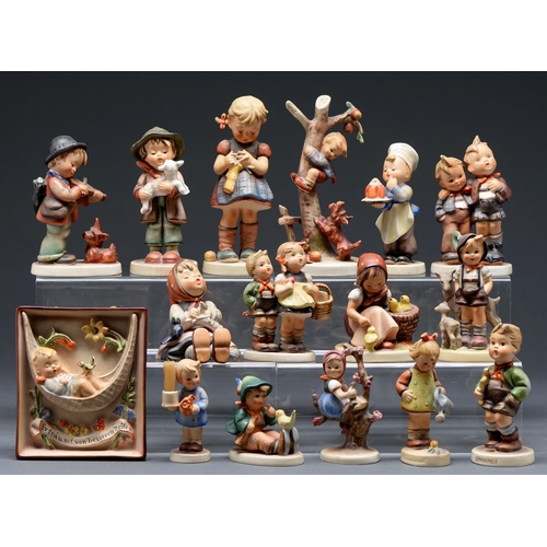 479 - Fifteen Goebel figures of children and a plaque, modelled by M J Hummel, various sizes, printed mark... 