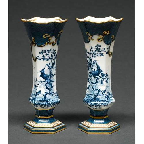 517 - A pair of Royal Worcester flared hexagonal powder blue ground vases, 1912, printed and painted ... 