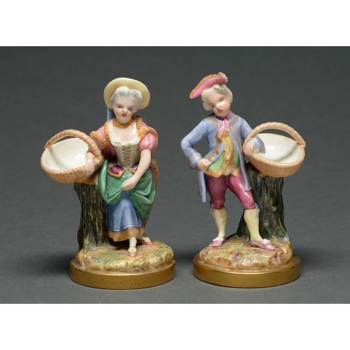 520 - A pair of Royal Worcester boy and girl figures with baskets, c1875,  brightly decorated in poly... 