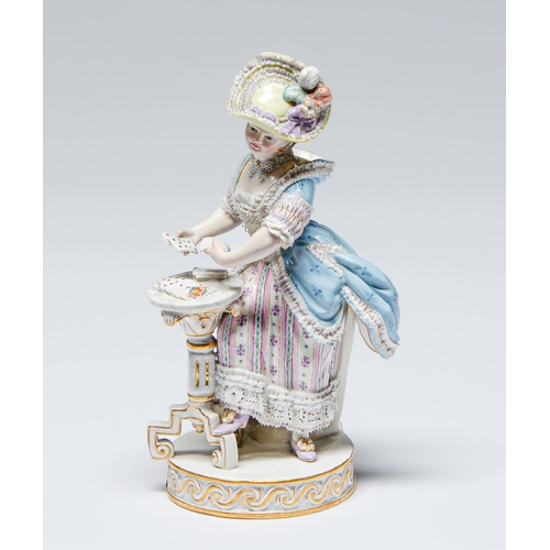 568 - A Meissen figure of a card player, late 19th c, after the model by M V Acier, the young lady in 18th... 