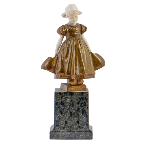 694 - H Dietrich. A gilt bronze and ivory statuette of a Dutch girl, early 20th c, on serpentine base, 17.... 