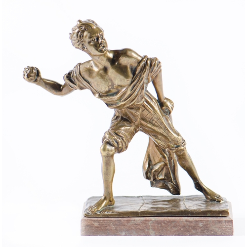 734 - A bronze statuette of a barefoot youth casting a stone, late 19th c, on later associated marble base... 