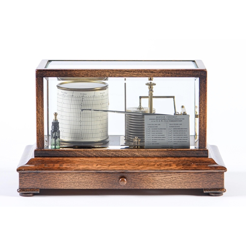 741 - An oak barograph, c1930, with lacquered brass mechanism, bevelled glass lights and chart drawer to b... 