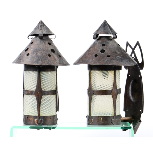 901 - A pair of arts and crafts early electric oxidised copper wall lights, probably Birmingham School, po... 