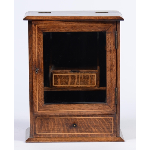 905 - An Edwardian oak and inlaid smoker's cabinet, with fitted interior, glazed door and drawer, 38cm h... 