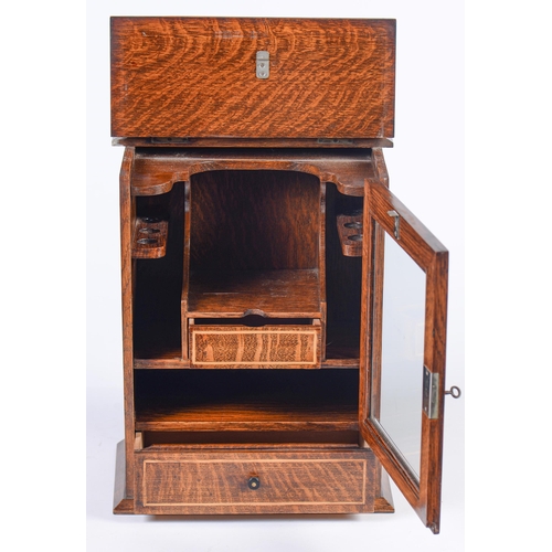 905 - An Edwardian oak and inlaid smoker's cabinet, with fitted interior, glazed door and drawer, 38cm h... 