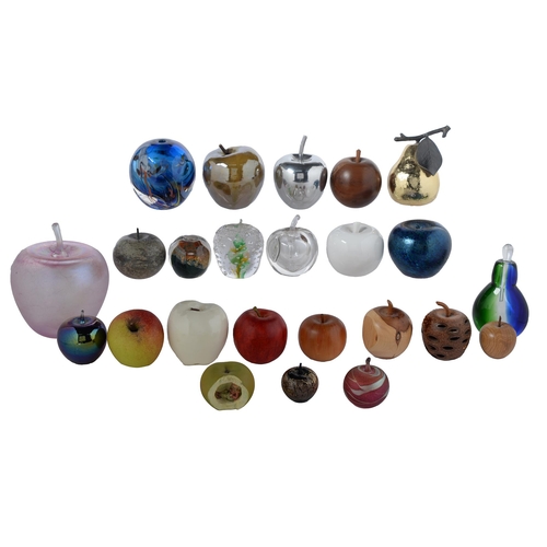 932 - A collection of glass, wood and stone paperweights, mostly in the form of an apple, 20th c, various ... 