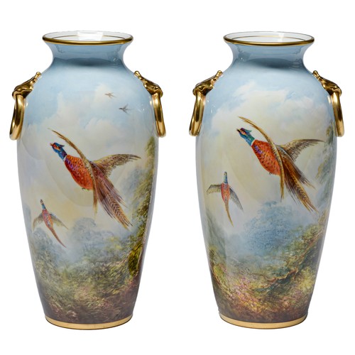 564 - A pair of Minton bone china vases, c1951-1961,  with gilt ring shoulder handles, painted by A H... 