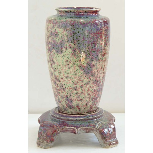 497 - A Ruskin flambe glazed vase and stand, 1926, the vase of shouldered form and covered in a fine mottl... 