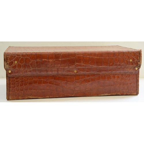 782 - A crocodile hide dressing case, early 20th c, marked on gilt brass locks Finnegans Ltd London, key, ... 