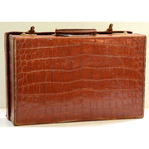 782 - A crocodile hide dressing case, early 20th c, marked on gilt brass locks Finnegans Ltd London, key, ... 