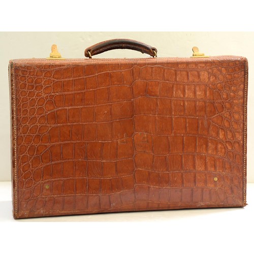 782 - A crocodile hide dressing case, early 20th c, marked on gilt brass locks Finnegans Ltd London, key, ... 